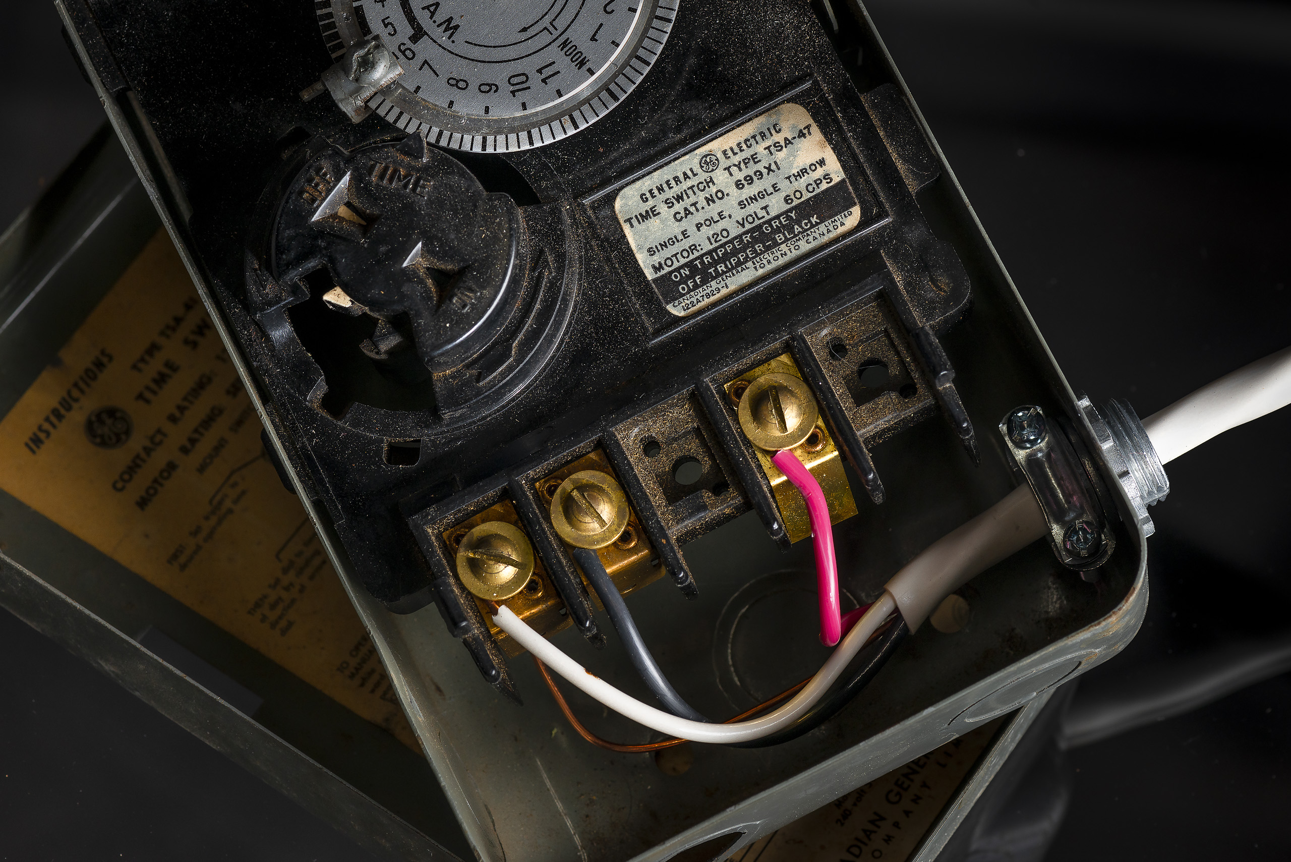 Inside of an old timer box with new coloured wires.